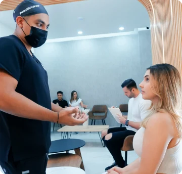 Experienced dentist attending to a patient in Puerto Vallarta, showing a professional and friendly approach.