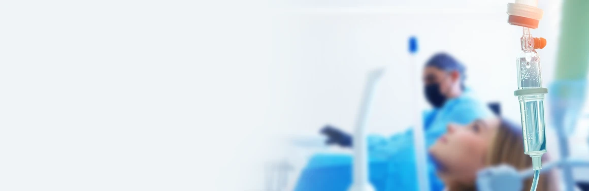 Patient receiving dental treatment under general anesthesia with a calm, relaxed expression