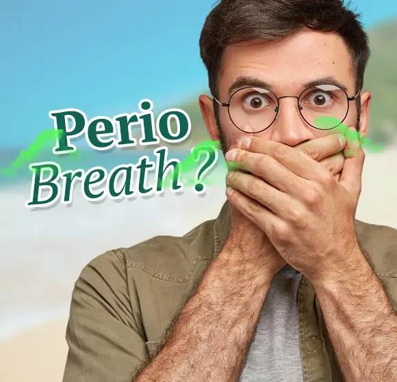 Smiling person showing fresh, healthy gums after treating perio breath